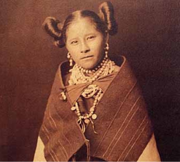 Hopi woman with a pot and traditional clothing