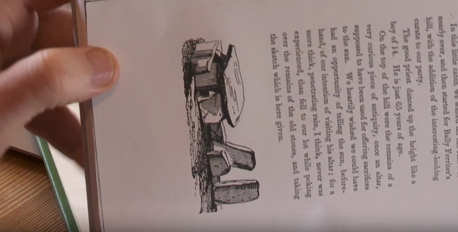 Screenshot of Bill Mag Fhloinn examining the drawing of the Altar of the Sun on Chatterton’s book