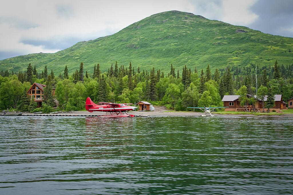 A small red plane rests on the Agulowak River in Southwestern Alaska