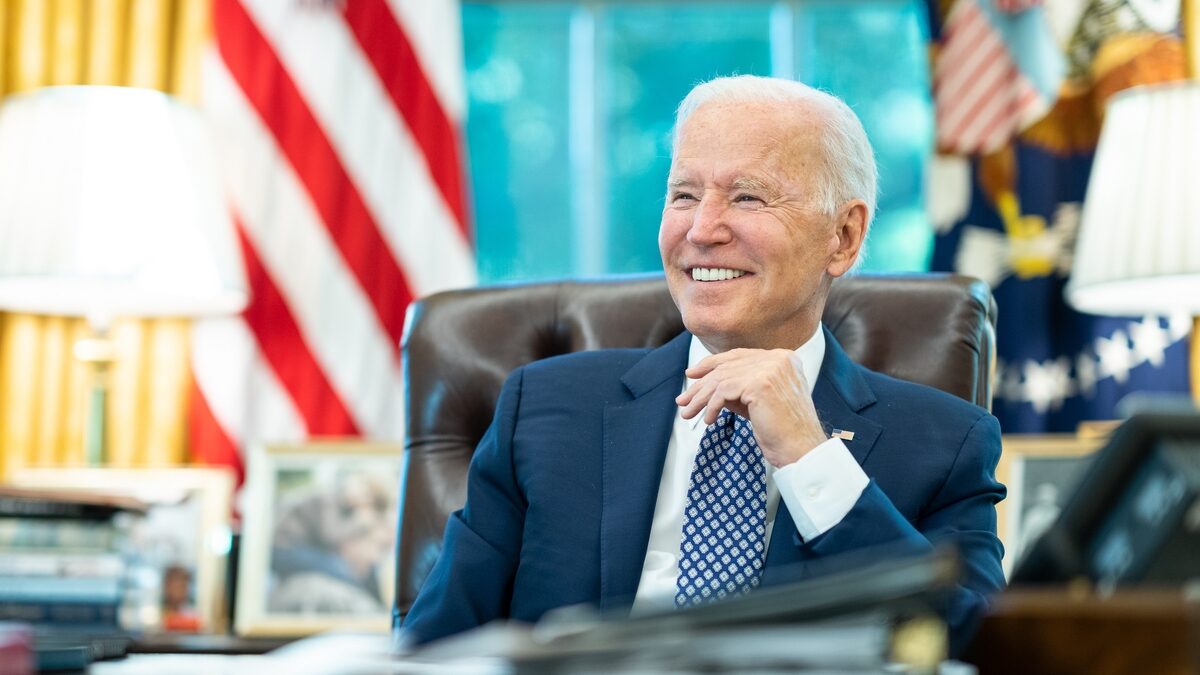 President Joe Biden talks on the phone with Tennessee Governor Bill Lee, R-Tenn., Tuesday, Aug. 24, 2021, in the Oval Office of the White House.