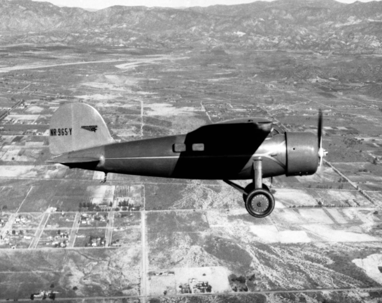Amelia Earhart in her Lockheed Vega plane flying over Burbank, California in 1934