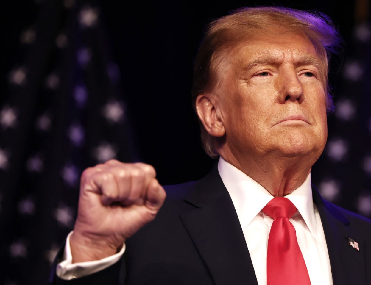 Republican presidential candidate and former US President Donald Trump greets supporters at his caucus night