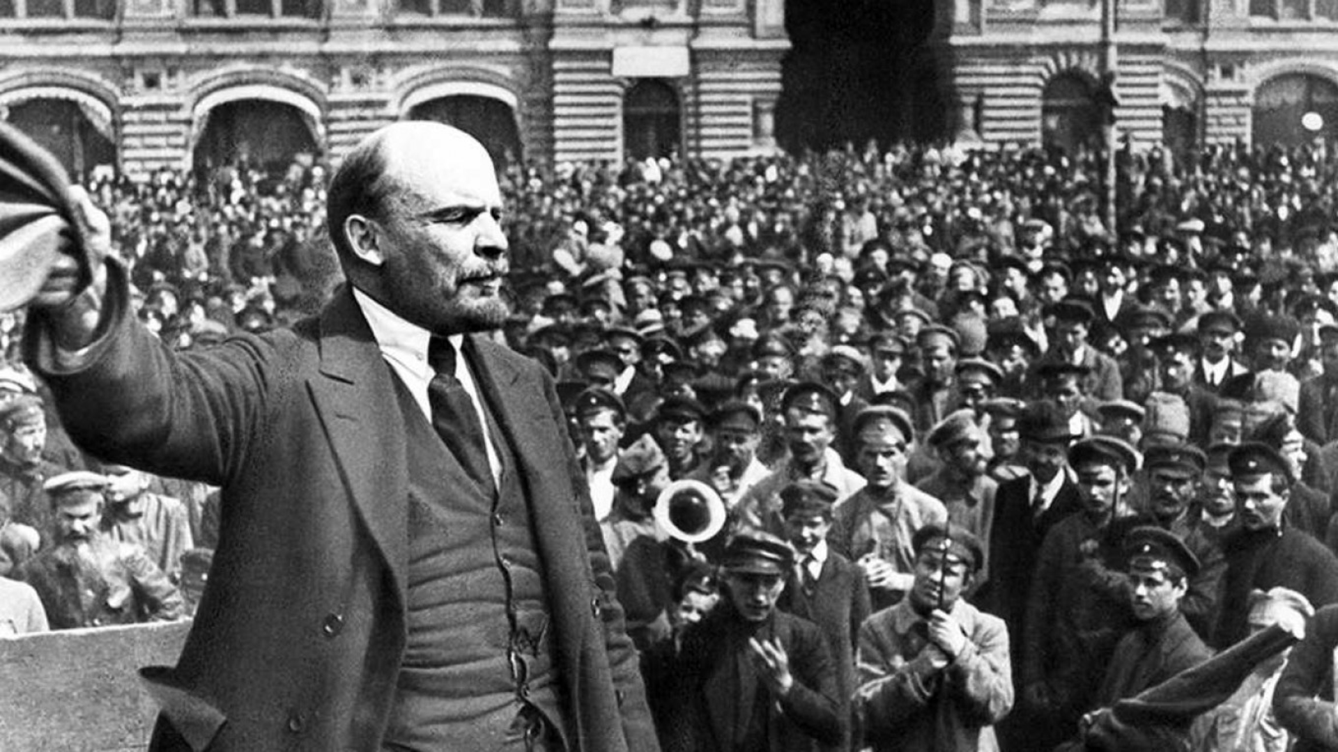 Black-and-white photo of Lenin giving a speech in 1917 before the October Revolution.