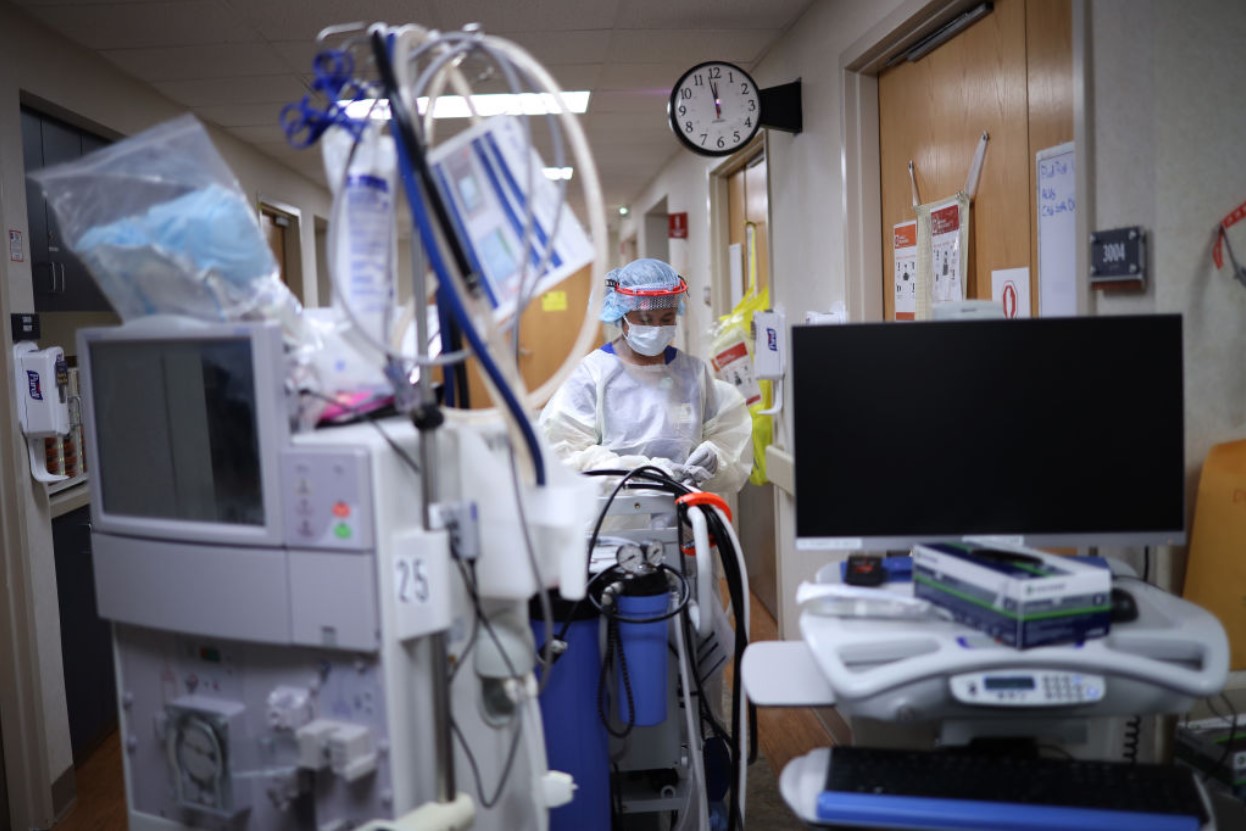 Nurse works in a hospital surrounded by modern machines