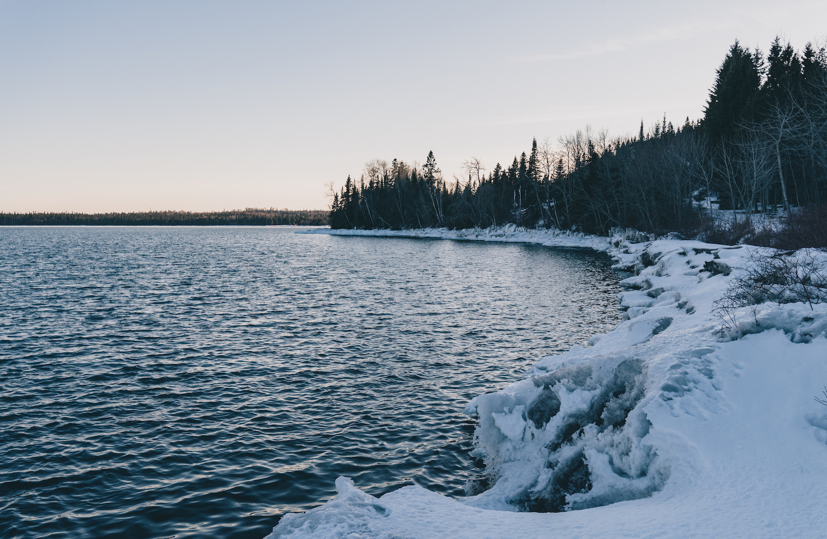 Snow-covered shores of Lake Superior at Grand Portage National Monument, Minnesota in winter.