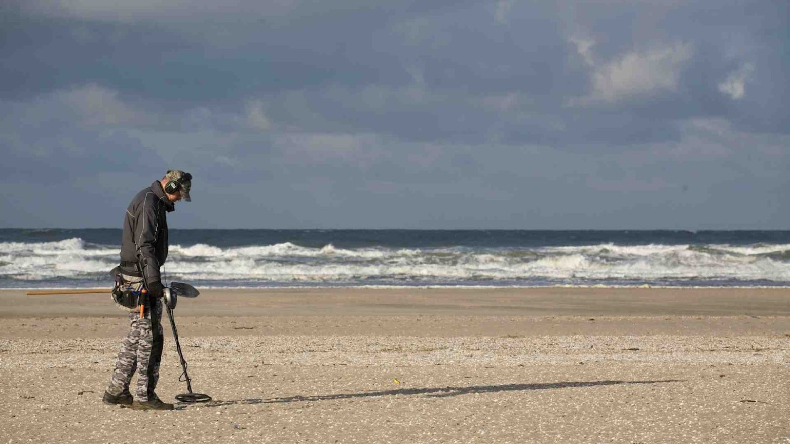 A man using a metal detector