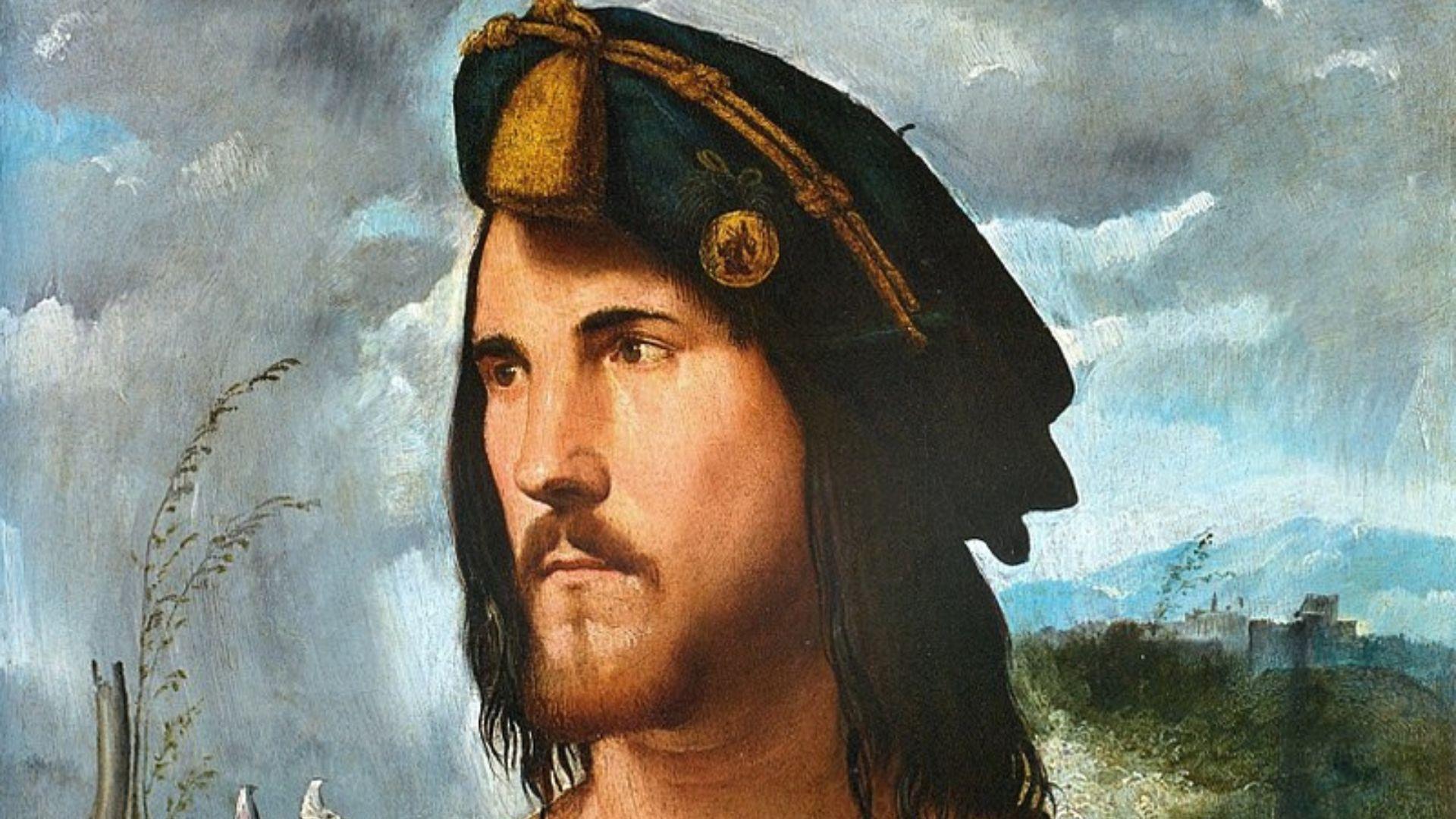 A painting of a handsome young man with long dark hair and a small beard wearing a Renaissance-style hat against a blue background. A beautiful landscape behind him with a mountain in the distance.