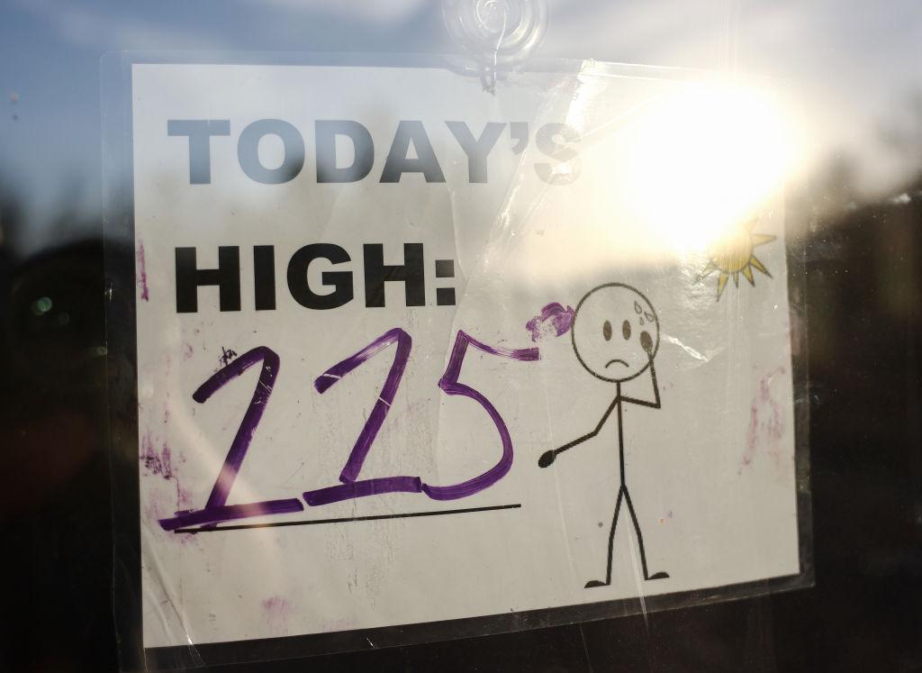 A sign reading 'Today's High: 115' is posted in South Mountain Park
