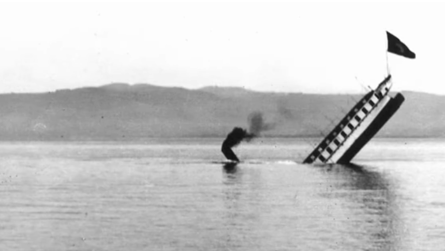 Photograph of the Saentis steamship, known as the “Titanic of the Alps” sinking on Lake Constance in 1933