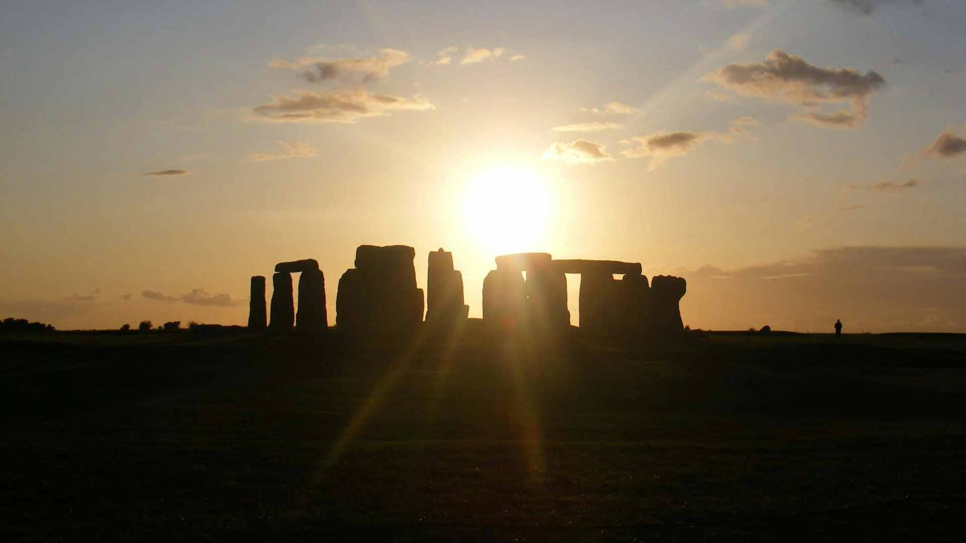 The Stonehenge monument obscured by shadow.