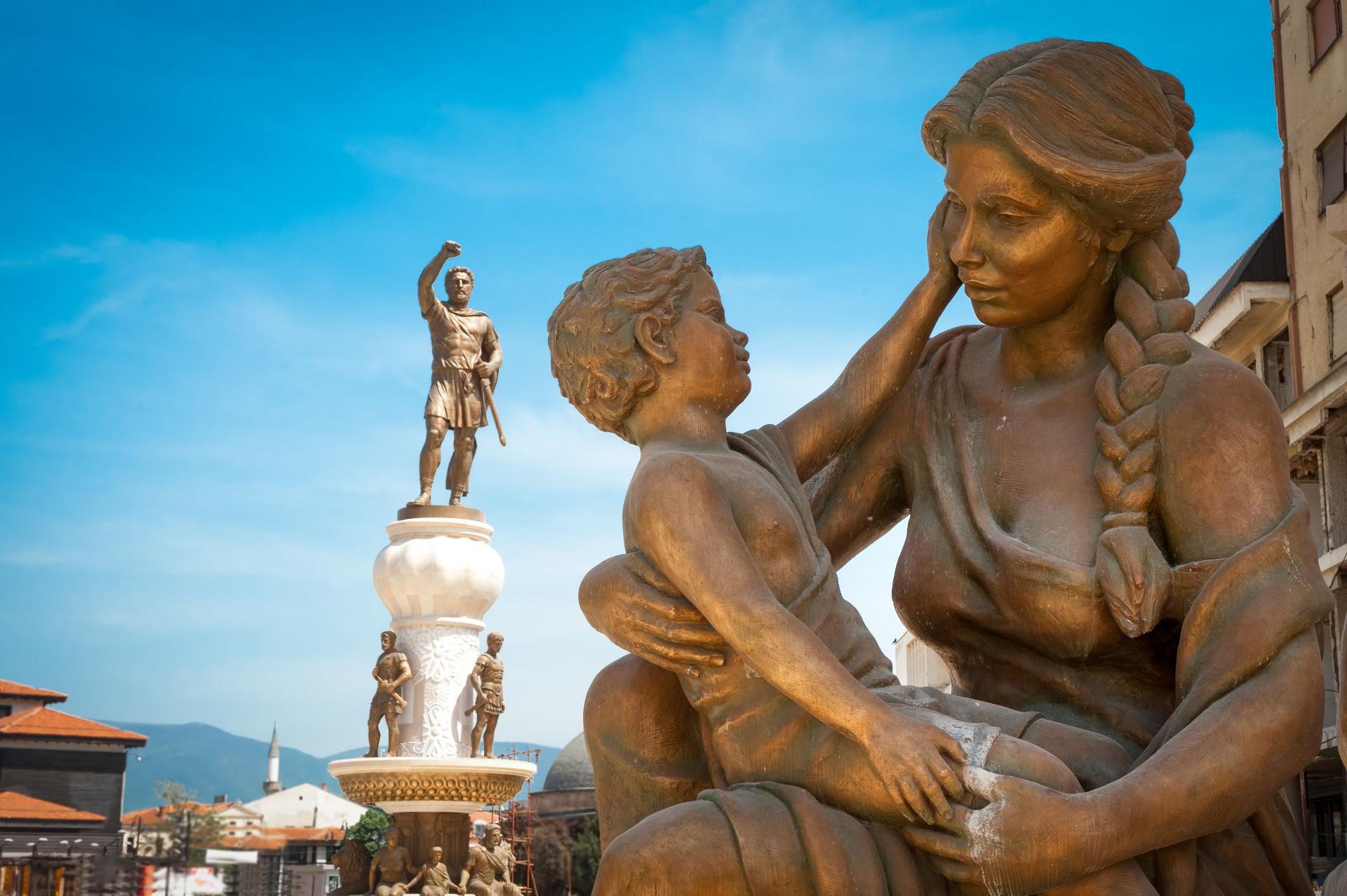 Statues of baby Alexander The Great, his mother Olympias and his father King Philip in the city square of Skopje, North Macedonia