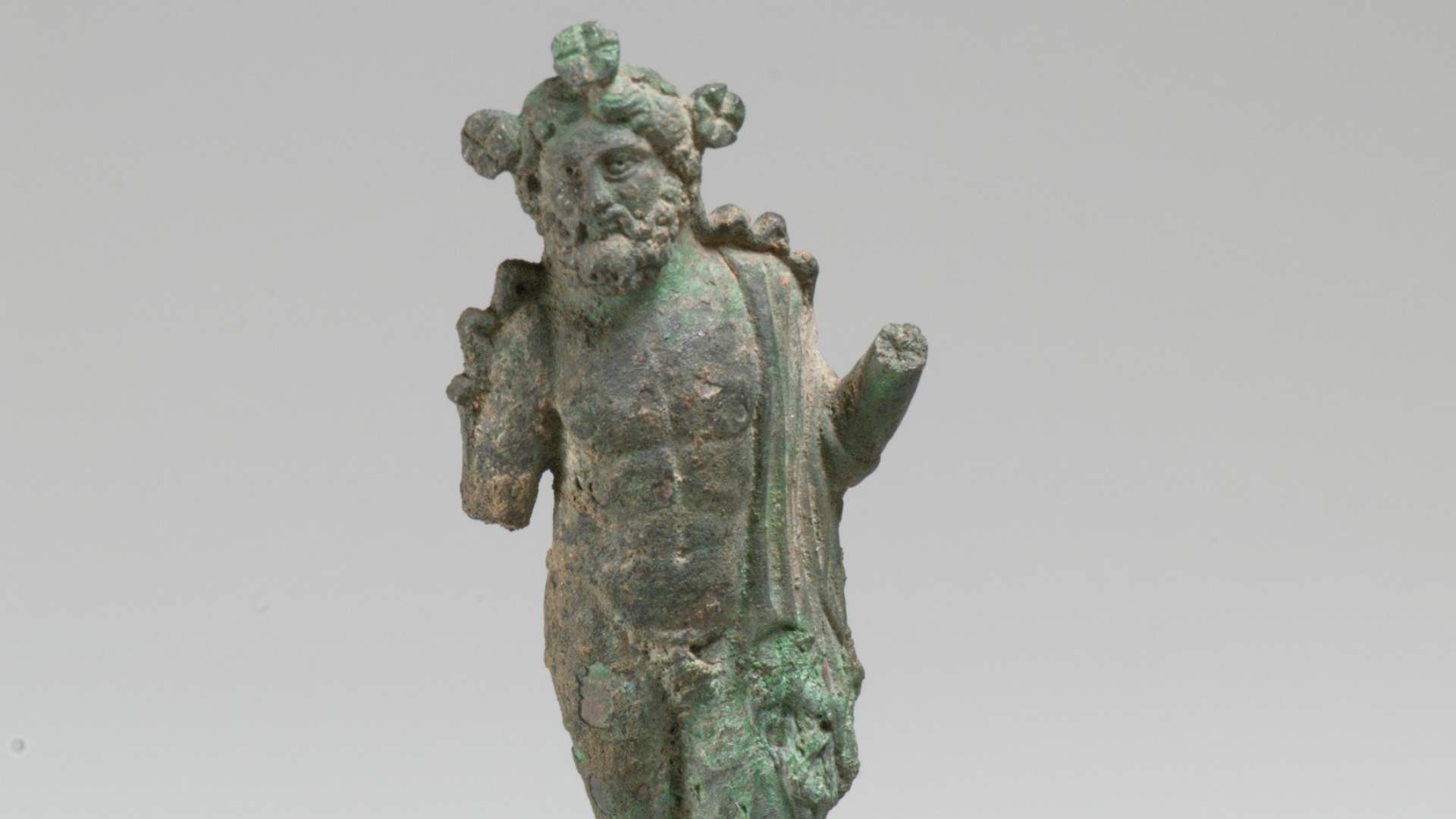 A small statue of the Greek God Zeus.