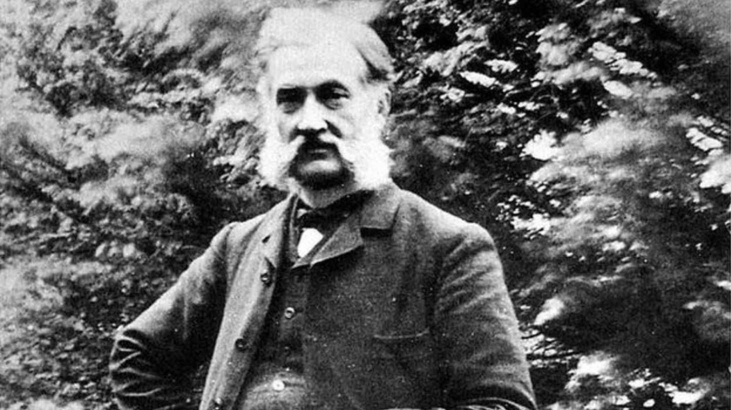Black and white photograph of Louis Le Prince, a middle-aged man with a full head of hair and a full beard, wearing a coat and tie. He appears to be standing outdoors