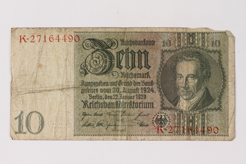 A Reichsmarks banknote on a white background