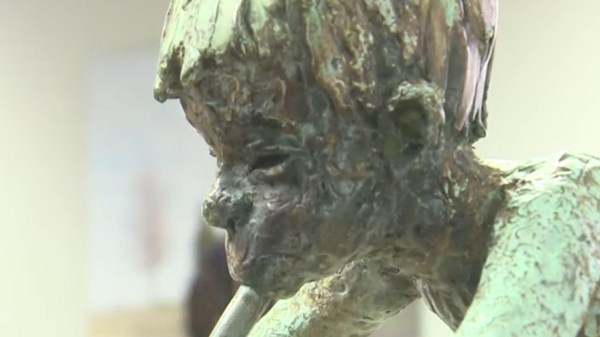 Close-up of the Pan statue after sitting outside for 30 years