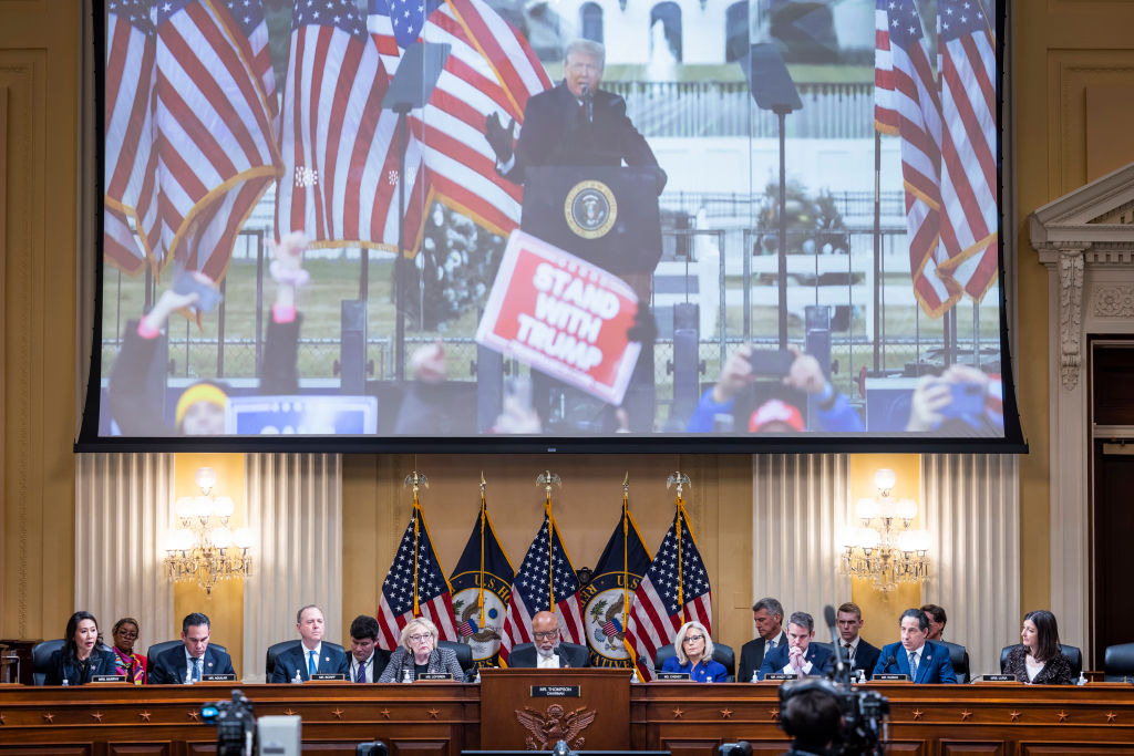 An image of former President Donald Trump is displayed as members of the House Select Committee to Investigate the January 6 Attack on the U.S. Capitol hold its last public meeting in the Canon House Office Building on Capitol Hill on December 19, 2022 in Washington, DC. The committee is expected to approve its final report and vote on referring charges to the Justice Department of insurrection, obstruction of an official proceeding of Congress and conspiracy to defraud the United States against former President Donald Trump.