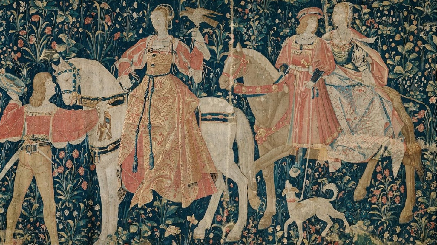 A detailed section of a medieval tapestry featuring noblemen and noblewomen on horseback. The figures are dressed in ornate period clothing with intricate patterns, and they are set against a dense floral background. A squire in red holds the reins of a horse, and a small dog runs at the feet of the horses