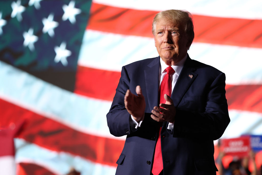 Former U.S. President Donald Trump greets supporters during a campaign rally at Minden-Tahoe Airport on October 08, 2022 in Minden, Nevada. Former U.S. President Donald Trump held a campaign style rally for Nevada GOP candidates ahead of the state's midterm election on November 8th.
