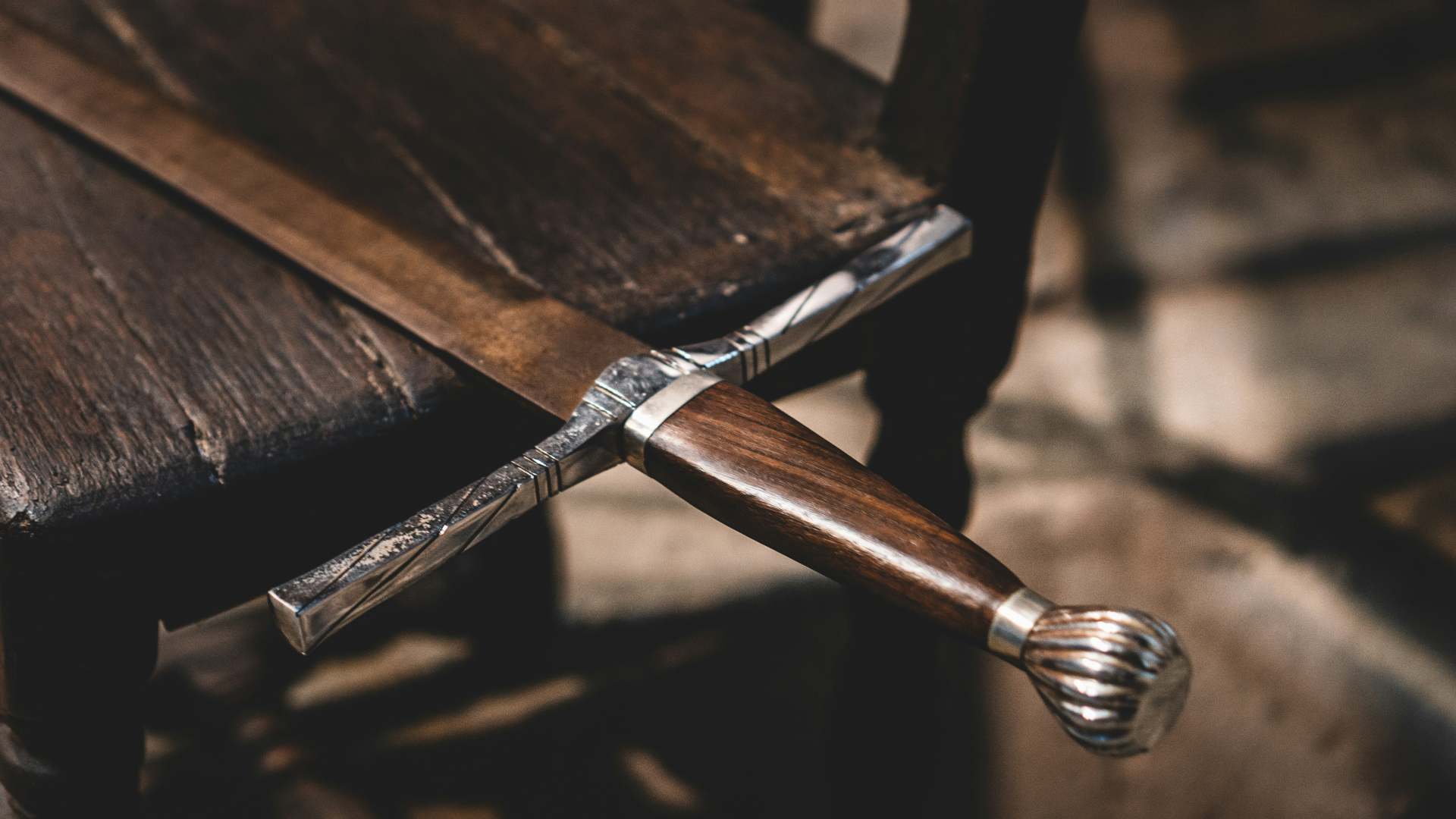 A medieval-style sword on a table.