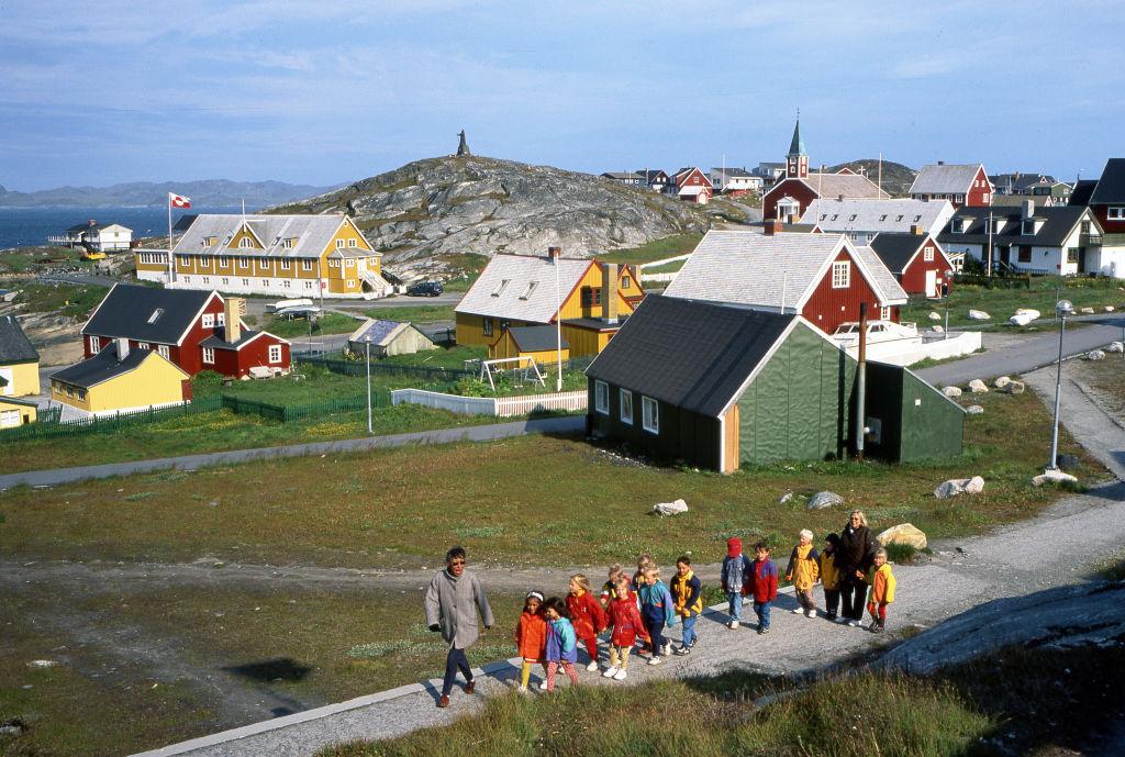 Children with their teachers at a school during a walk in the city of Nuuk, Greenland