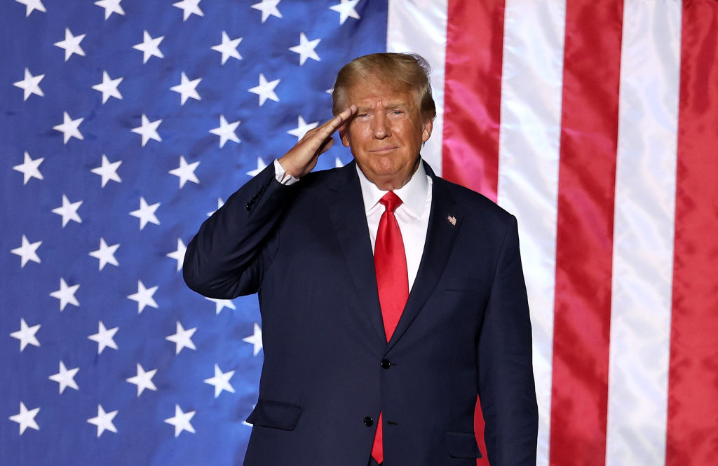 Former U.S. President Donald Trump salutes supporters during a campaign rally at Minden-Tahoe Airport on October 08, 2022 in Minden, Nevada. Former U.S. President Donald Trump held a campaign style rally for Nevada GOP candidates ahead of the state's midterm election on November 8th.