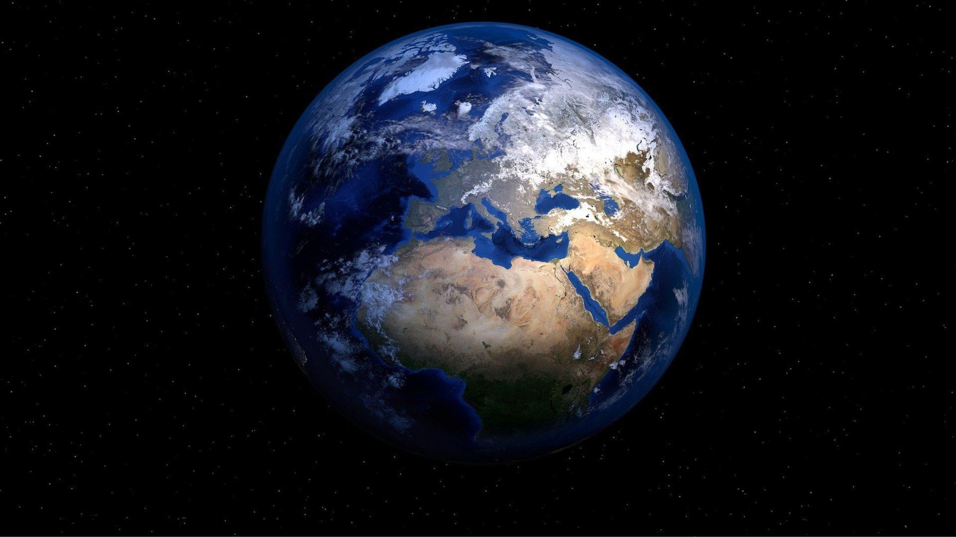 A view of planet Earth in outer space, showing an aerial view of continents amid a black background of space