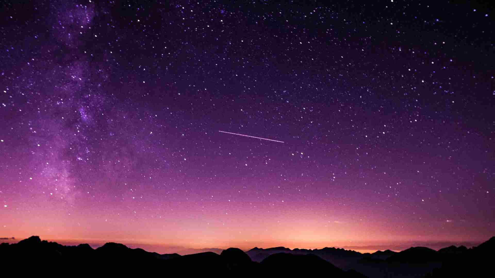 The sun sets in brilliant colors as the stars are visible.