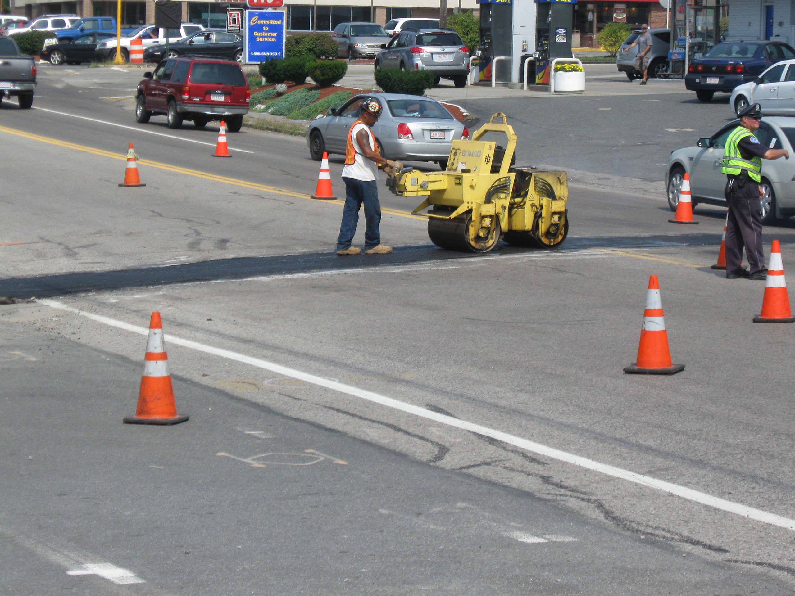 Construction workers working along Route 53 in Weymouth at the intersection of Middle Street and Winter Street.