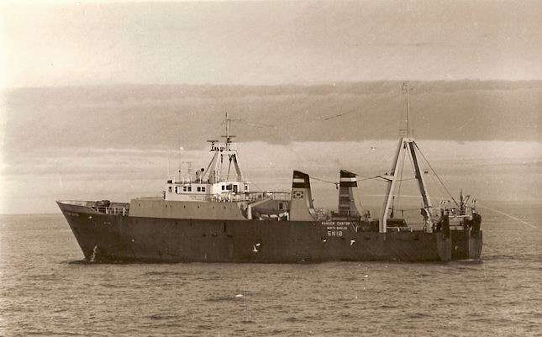 A sepia photo of a ship in the ocen