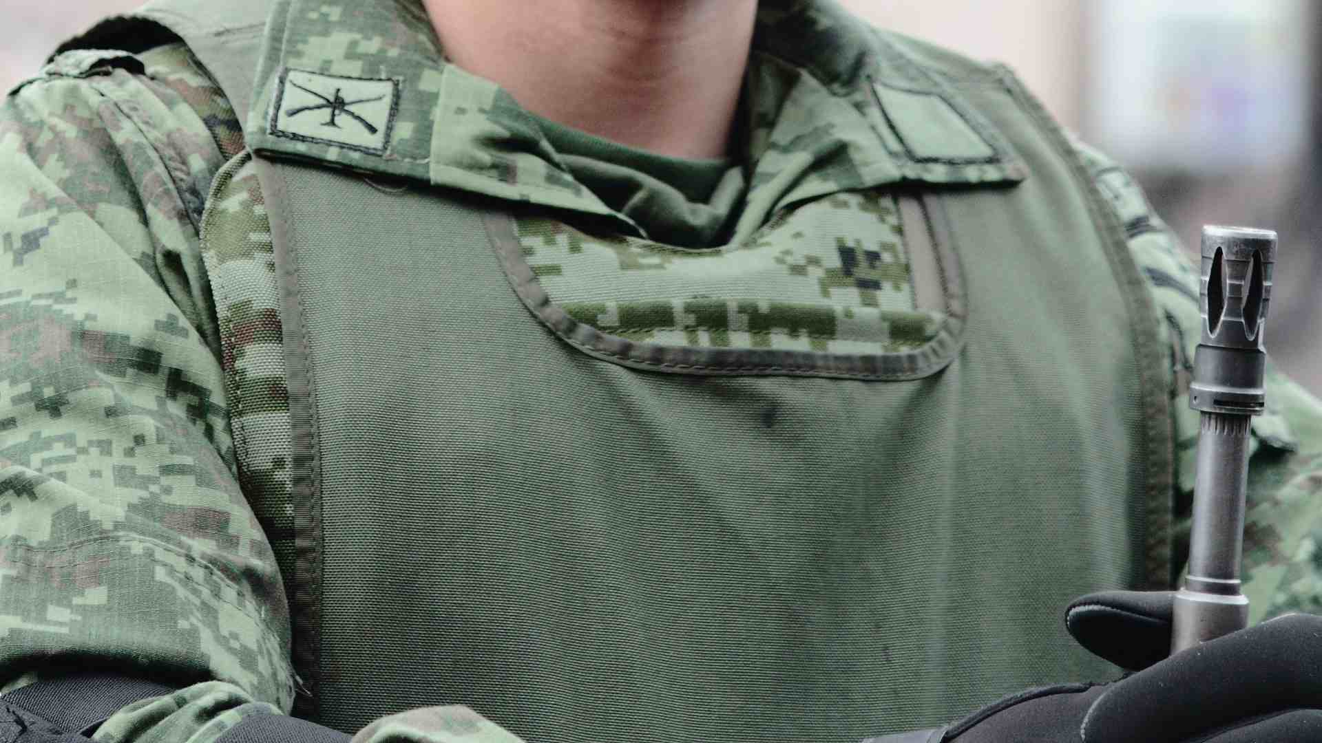 A photo of a soldier's torso.