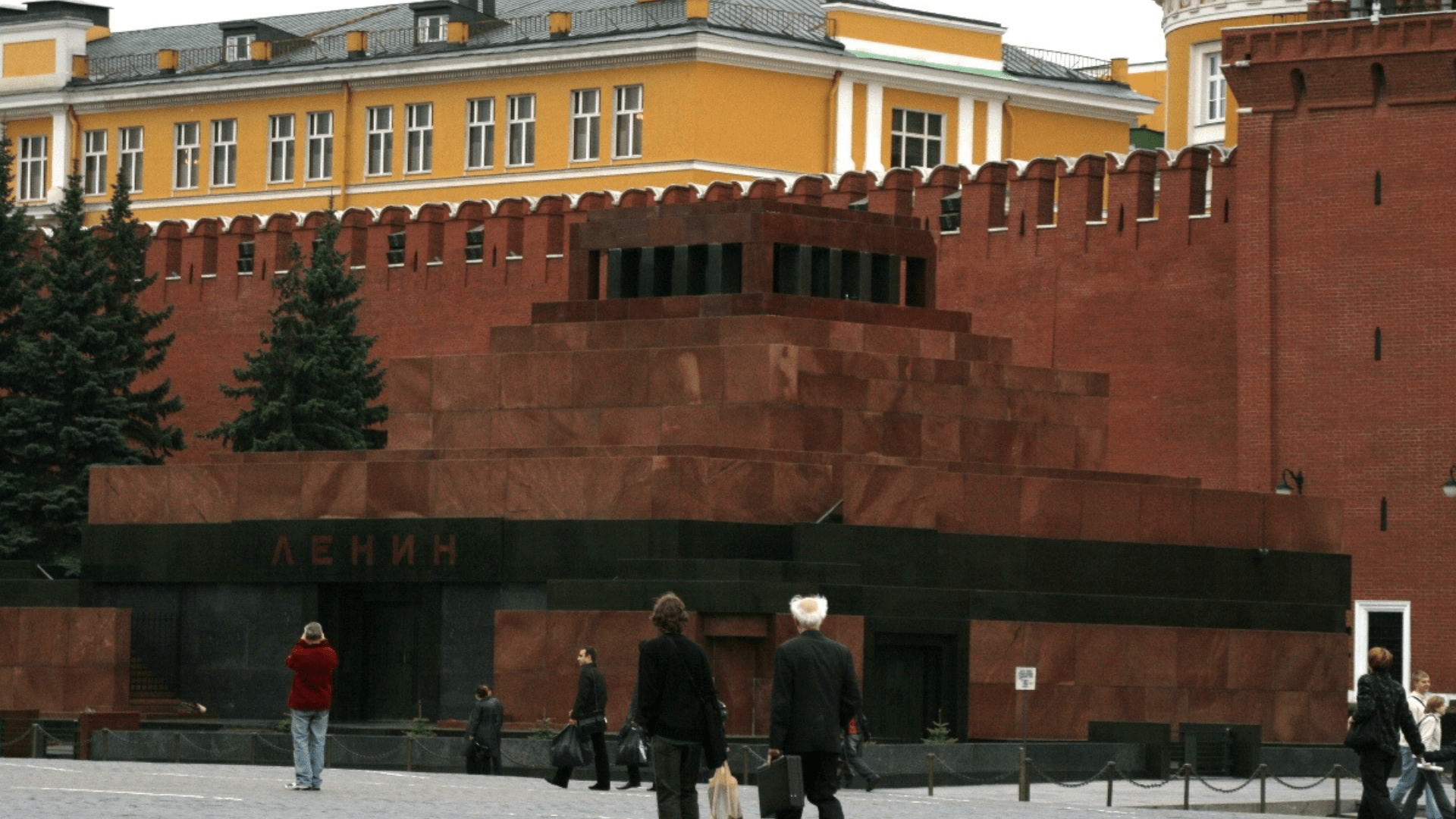 Lenin’s tomb outside of the Kremlin, photographed in 2005. It is made of tiered red marble with black highlights.