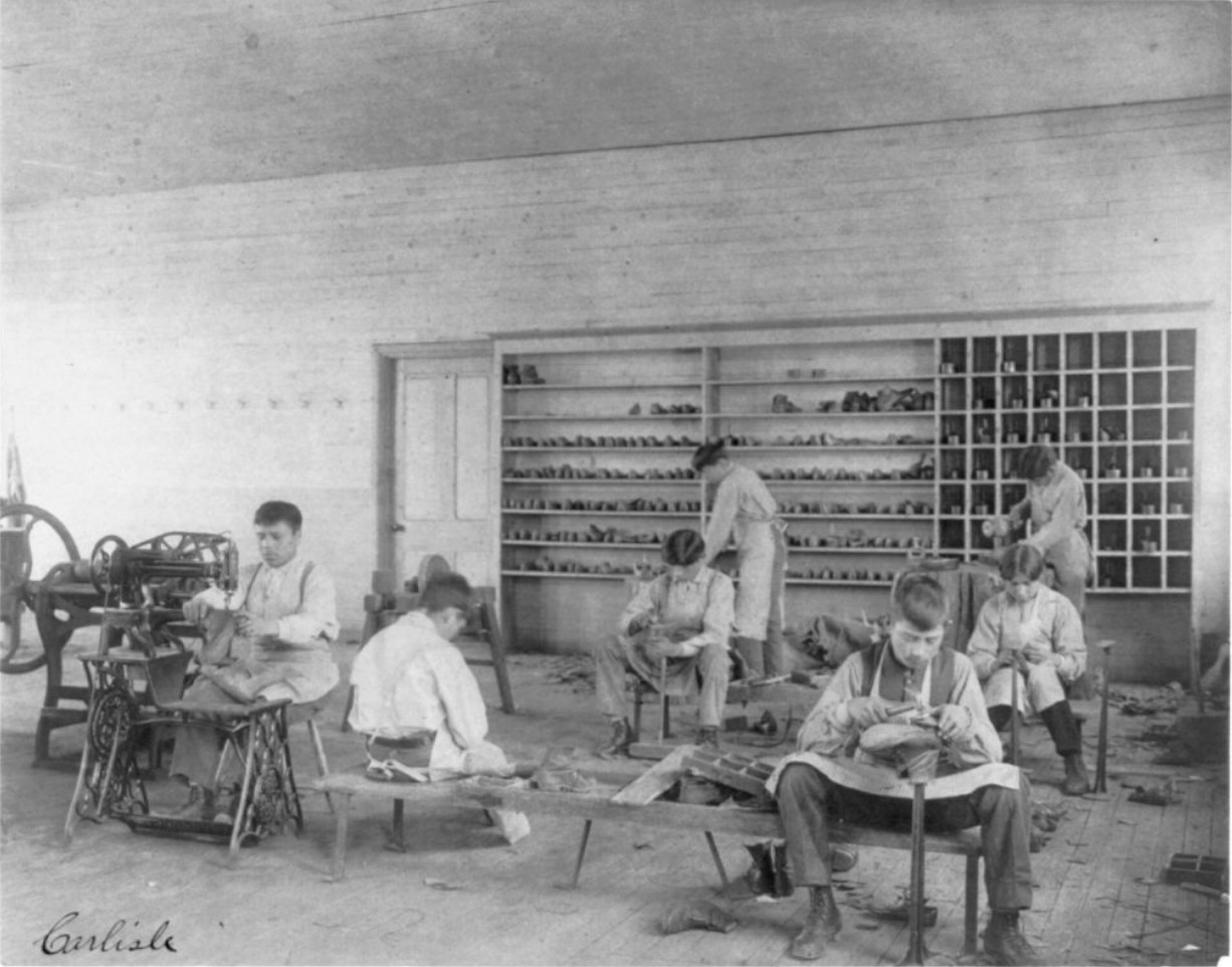 Classroom scenes at Carlisle, Pa., Indian School, shoe making and repairing; male students, 1901, Frances Benjamin Johnston
