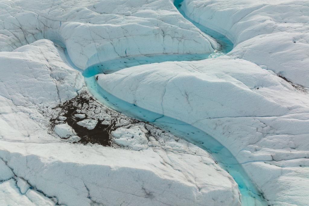 An aerial view of meltwater lakes formed at the Russell Glacier front, part of the Greenland ice sheet in Kangerlussuaq, Greenland, on August 16, 2022.