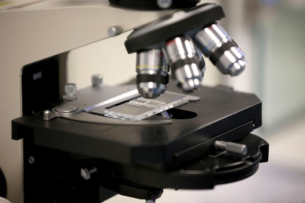 Close-up photograph of a high-tech microscope in a lab