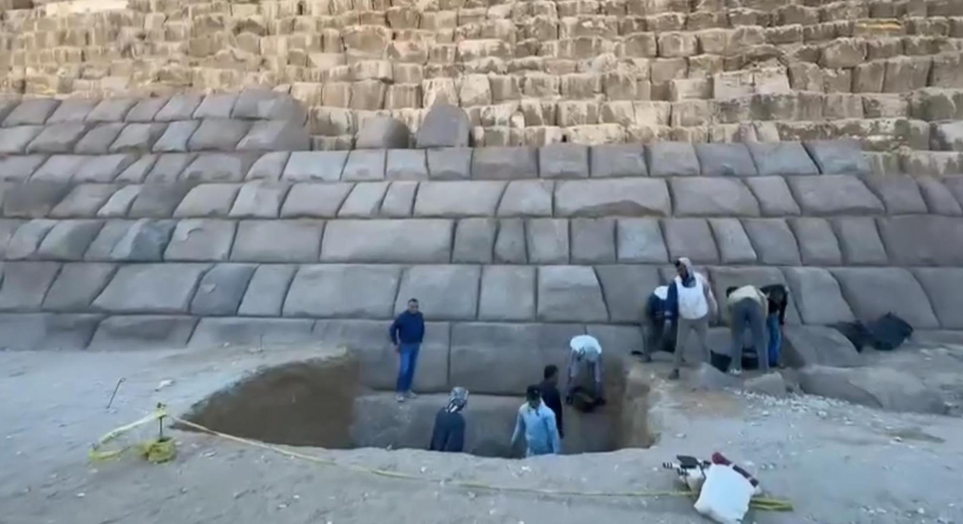 Waziry pictured as his team dig a large hole next to the Pyramid of Menkaure