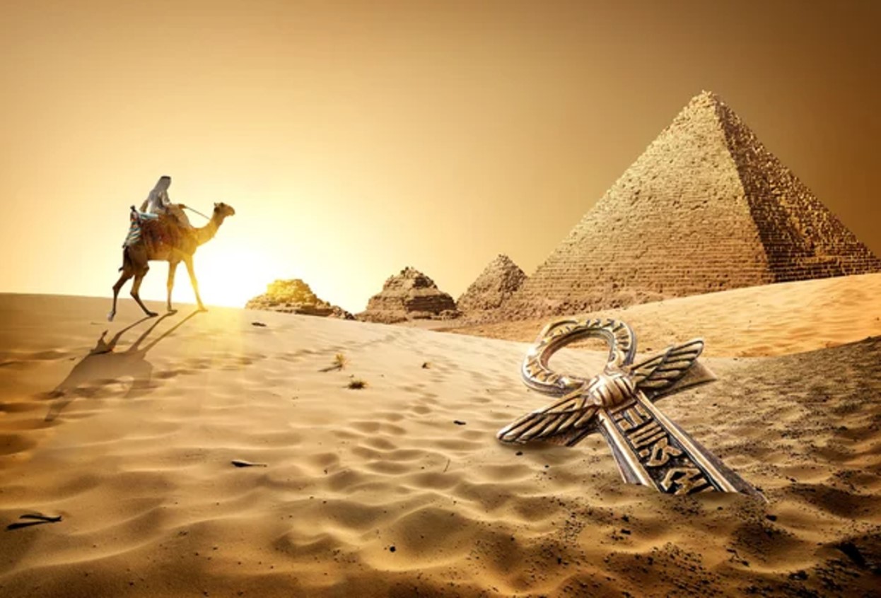 Digital illustration of a man on a camel walking toward the ruins of Ancient Egypt