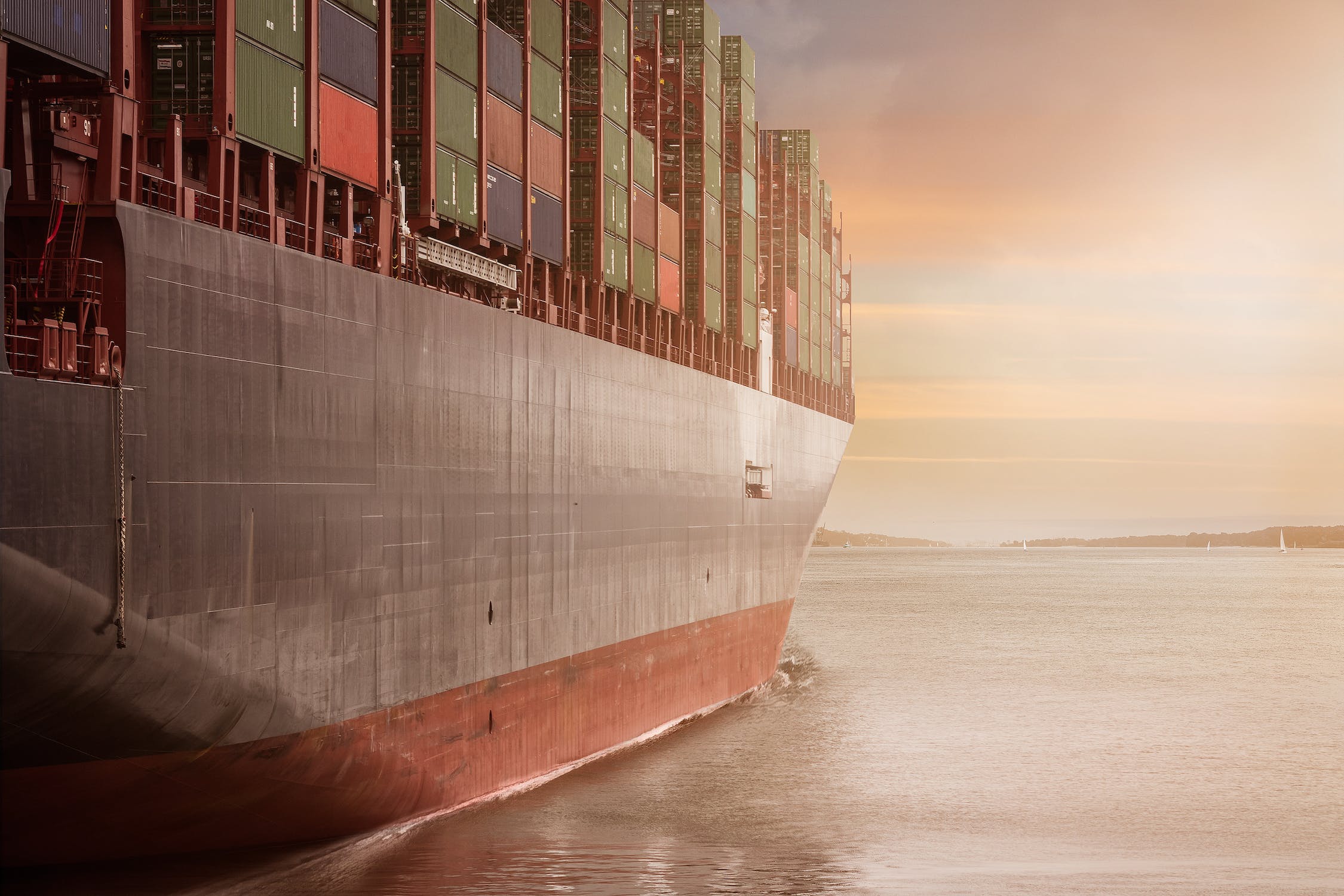 A cargo ship moving through the ocean