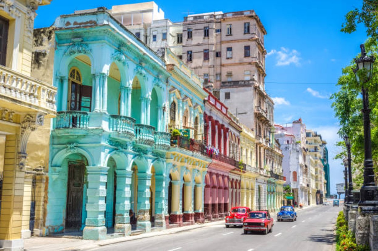 Colorful buildings and vintage cars on the streets of Cuba