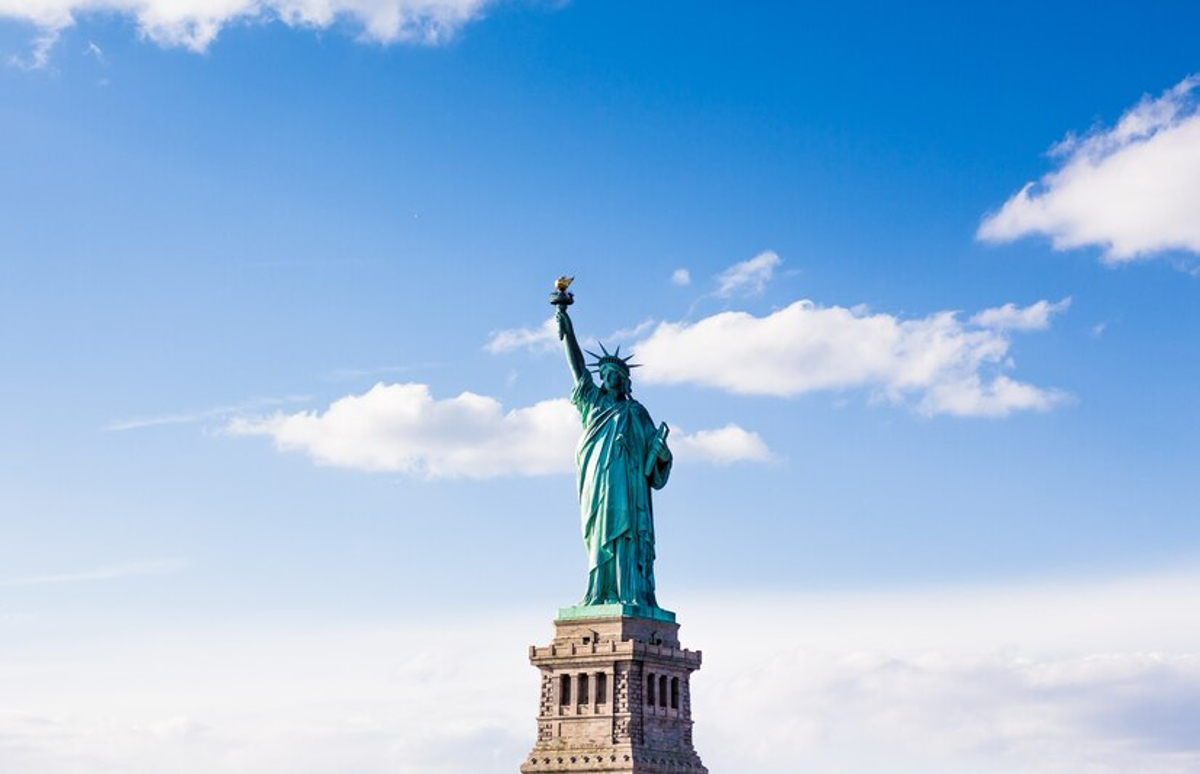 View of the Statue of Liberty against a blue sky
