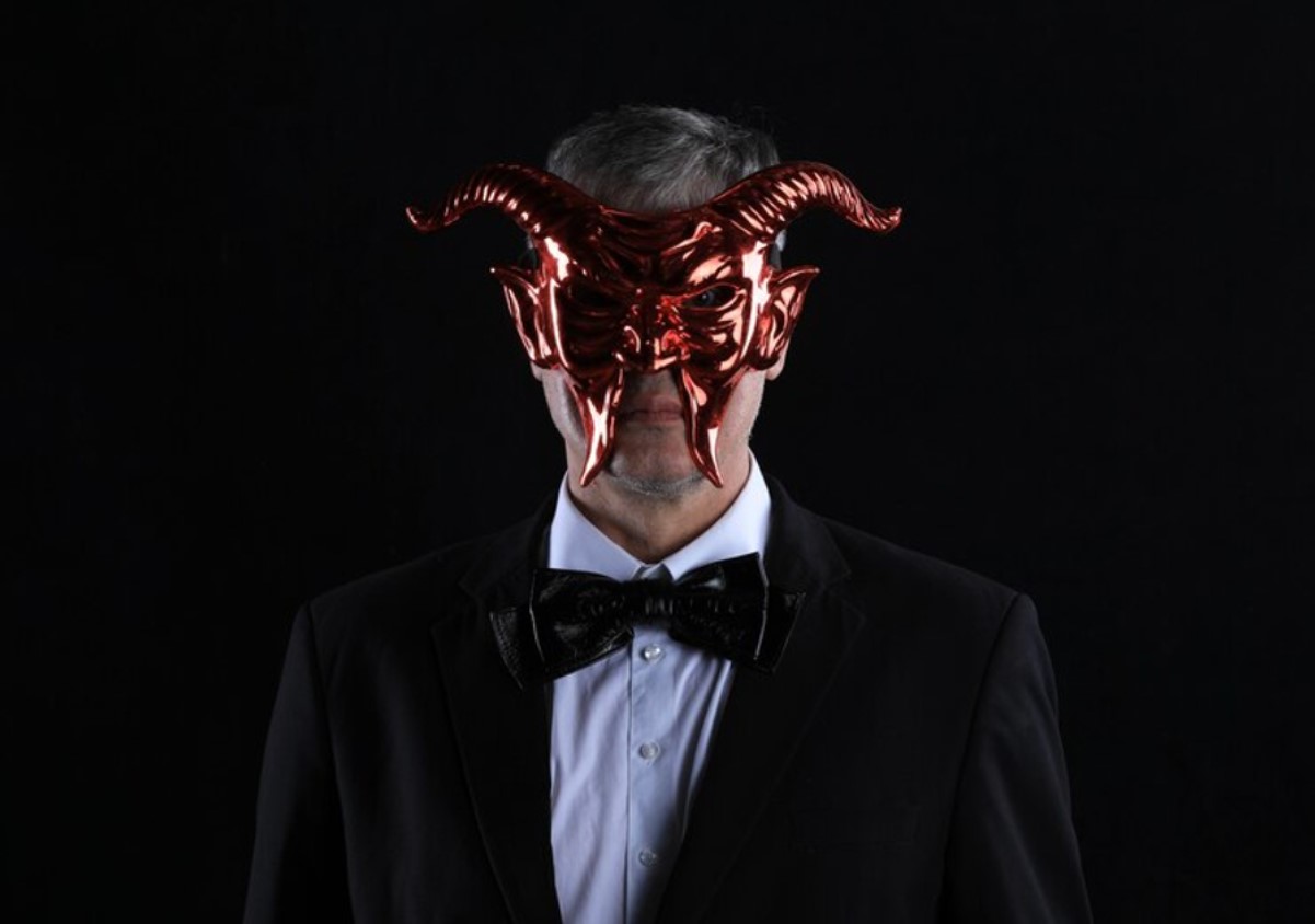 An image of a man dressed as the devil