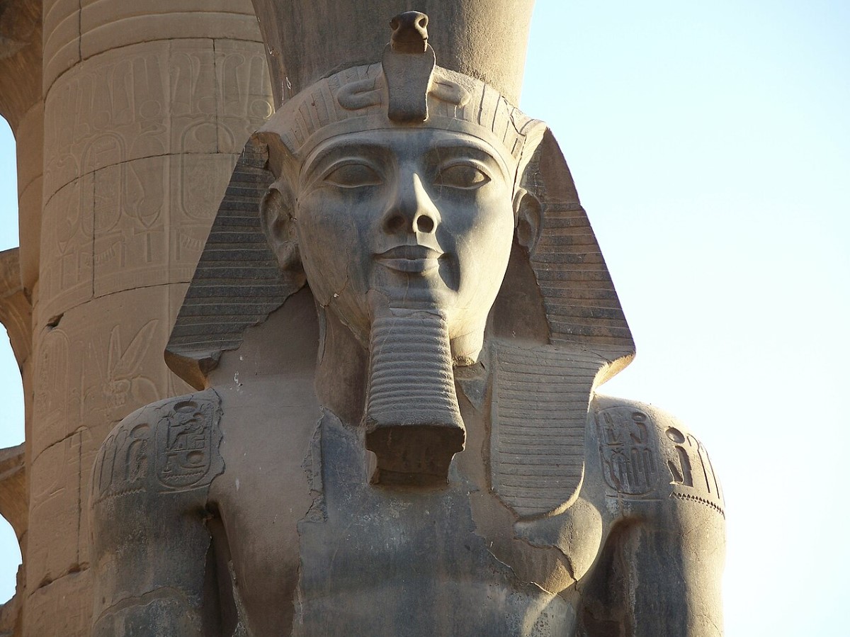 An up-close shot of a statue of Ramses II, which depicts the pharaoh with his crown