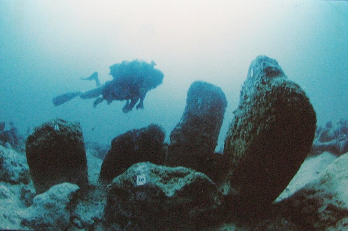 Photograph of a diver exploring a separate underwater site