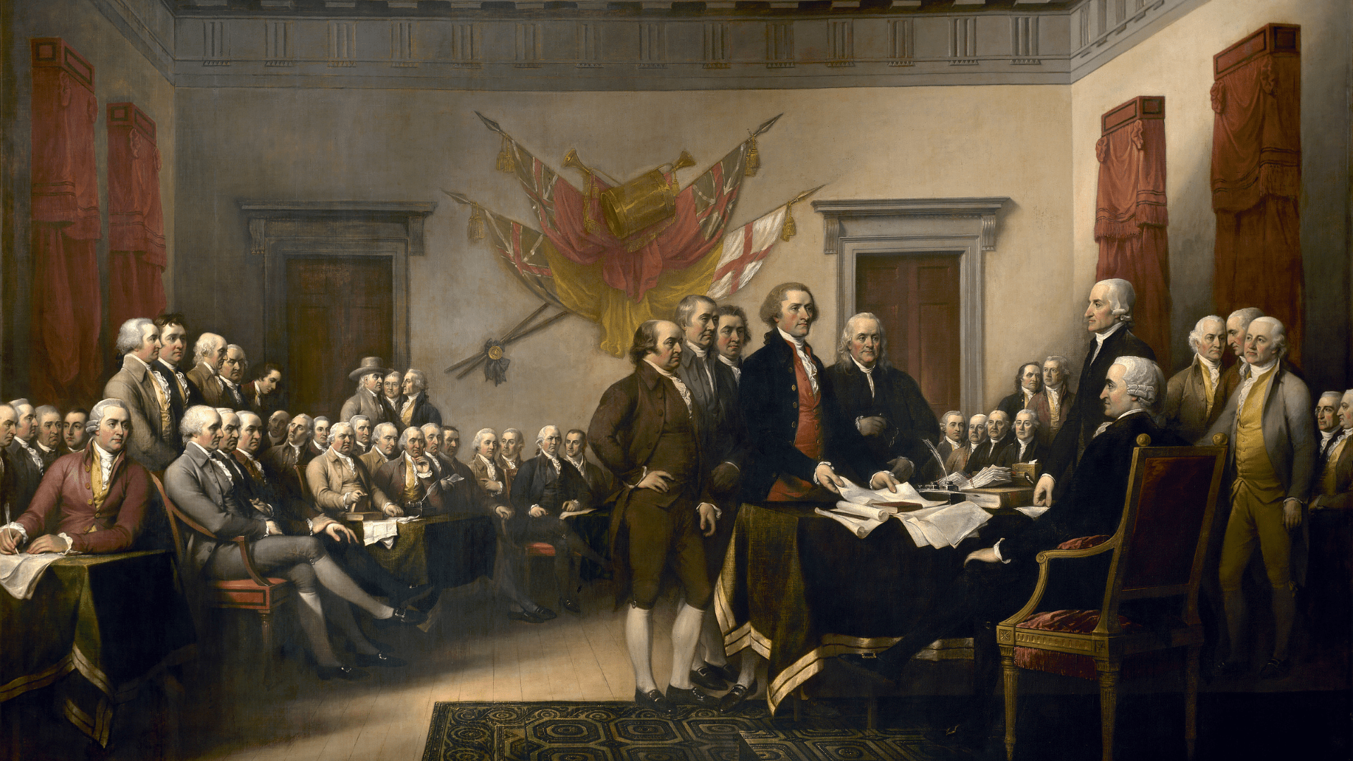 John Trumbull's painting, Declaration of Independence, depicting the five-man drafting committee of the Declaration of Independence presenting their work to the Congress. The painting can be found on the back of the U.S. $2 bill. The original hangs in the US Capitol rotunda. It does not represent a real ceremony; the characters portrayed were never in the same room at the same time.