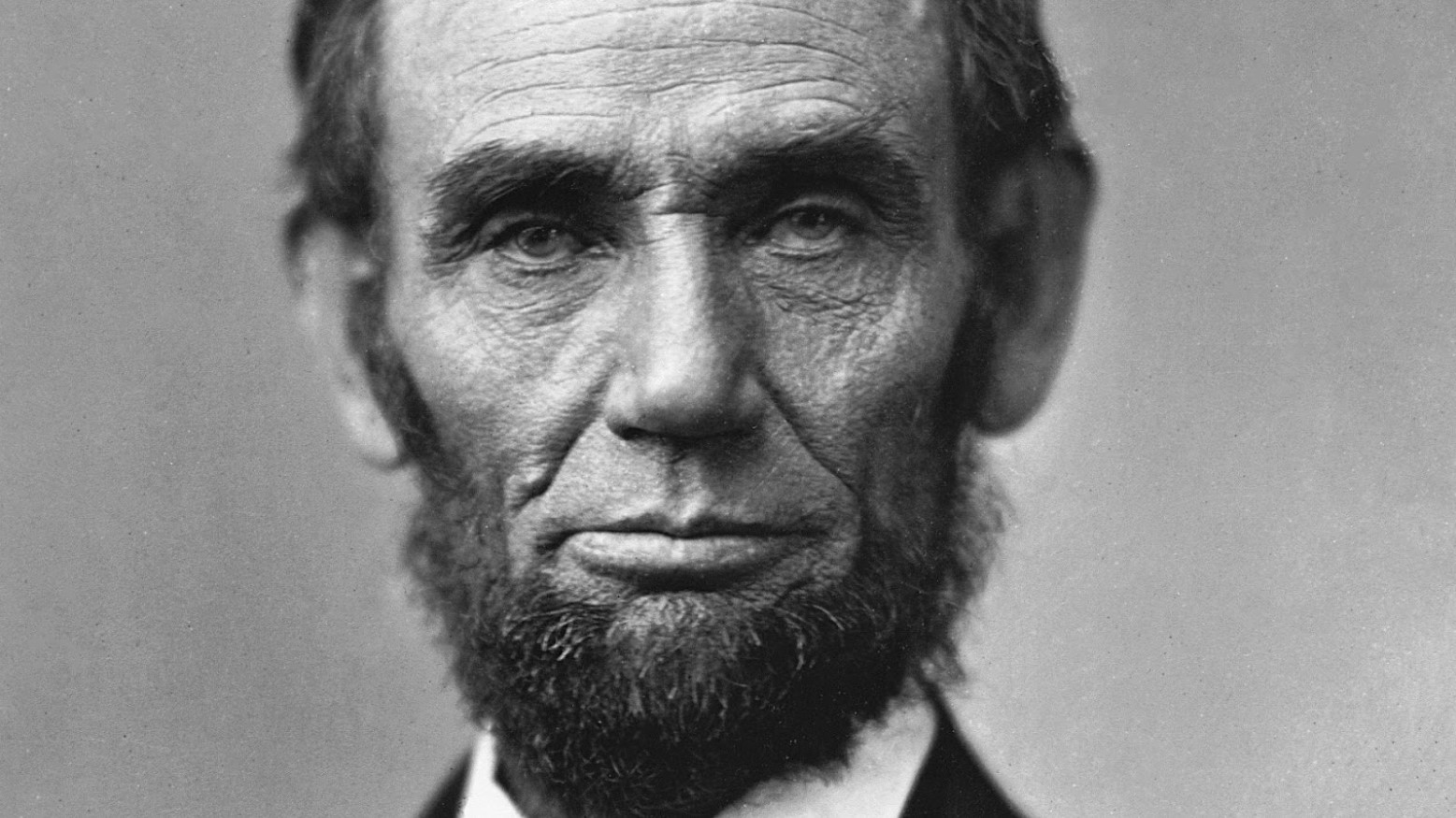 A black and white portrait of Abraham Lincoln.