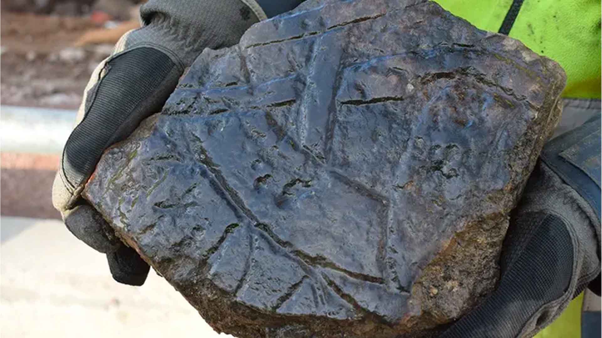 Limestone rune being held