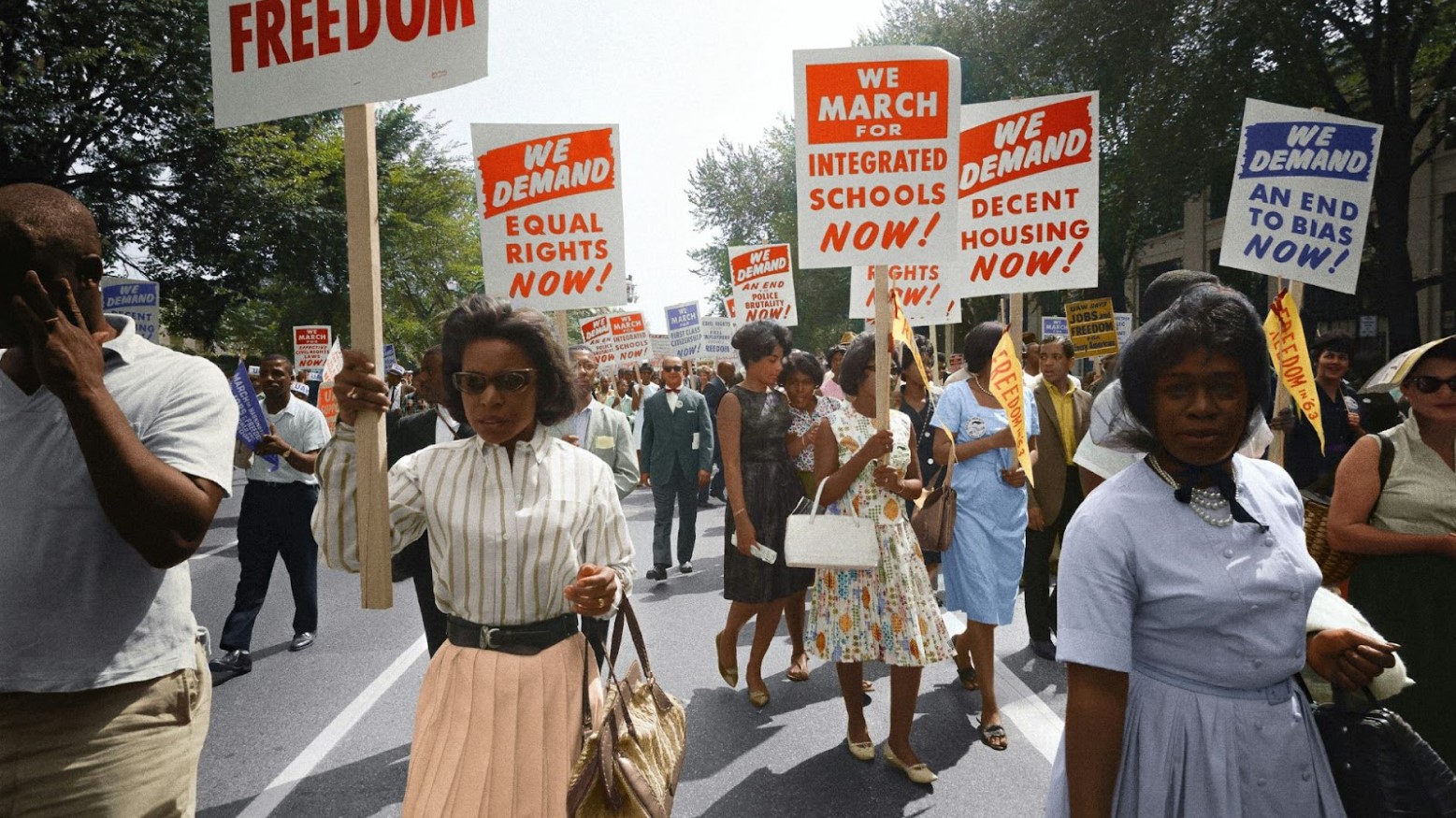 A colorized photo of people protesting during the Civil Rights Movement.