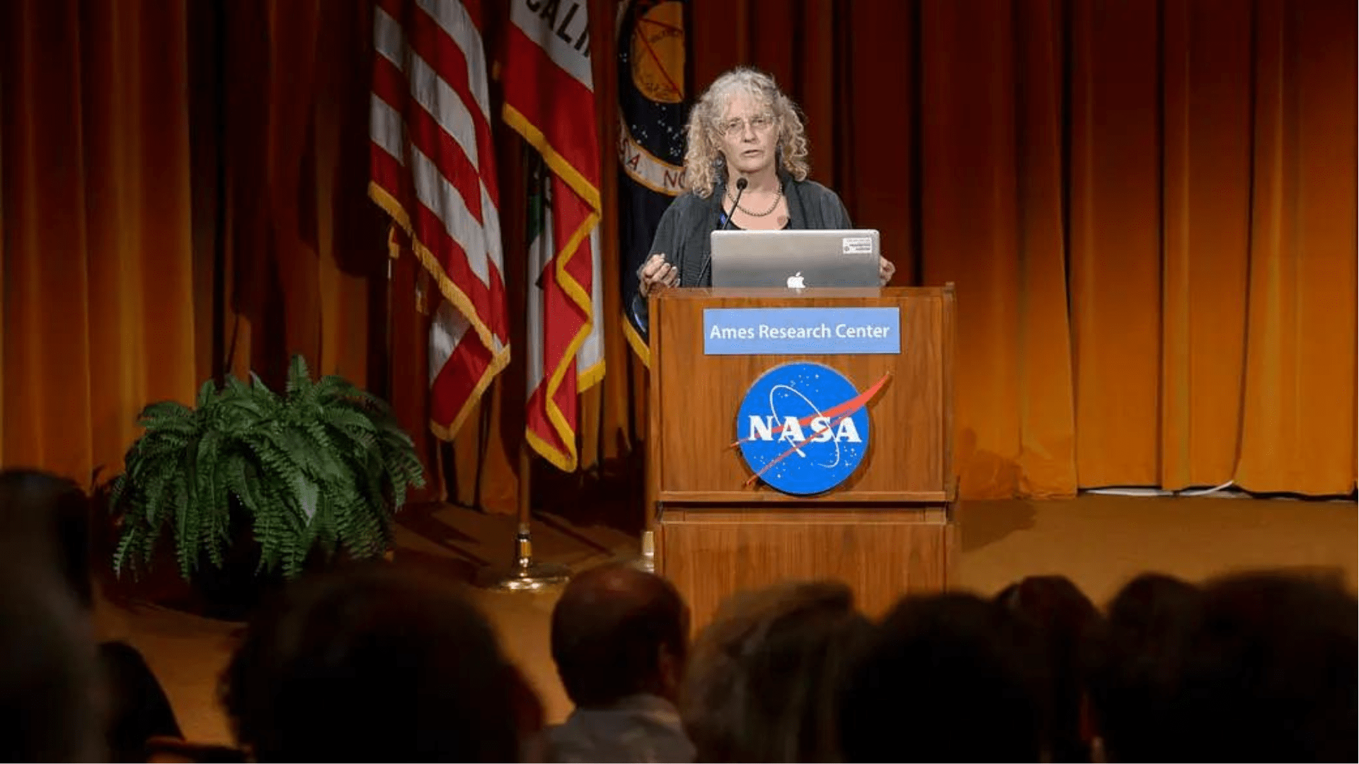 Penelope Boston from NASA lecturing before an audience.