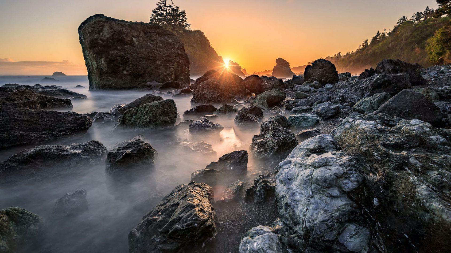 A beautiful rocky beach at sunset