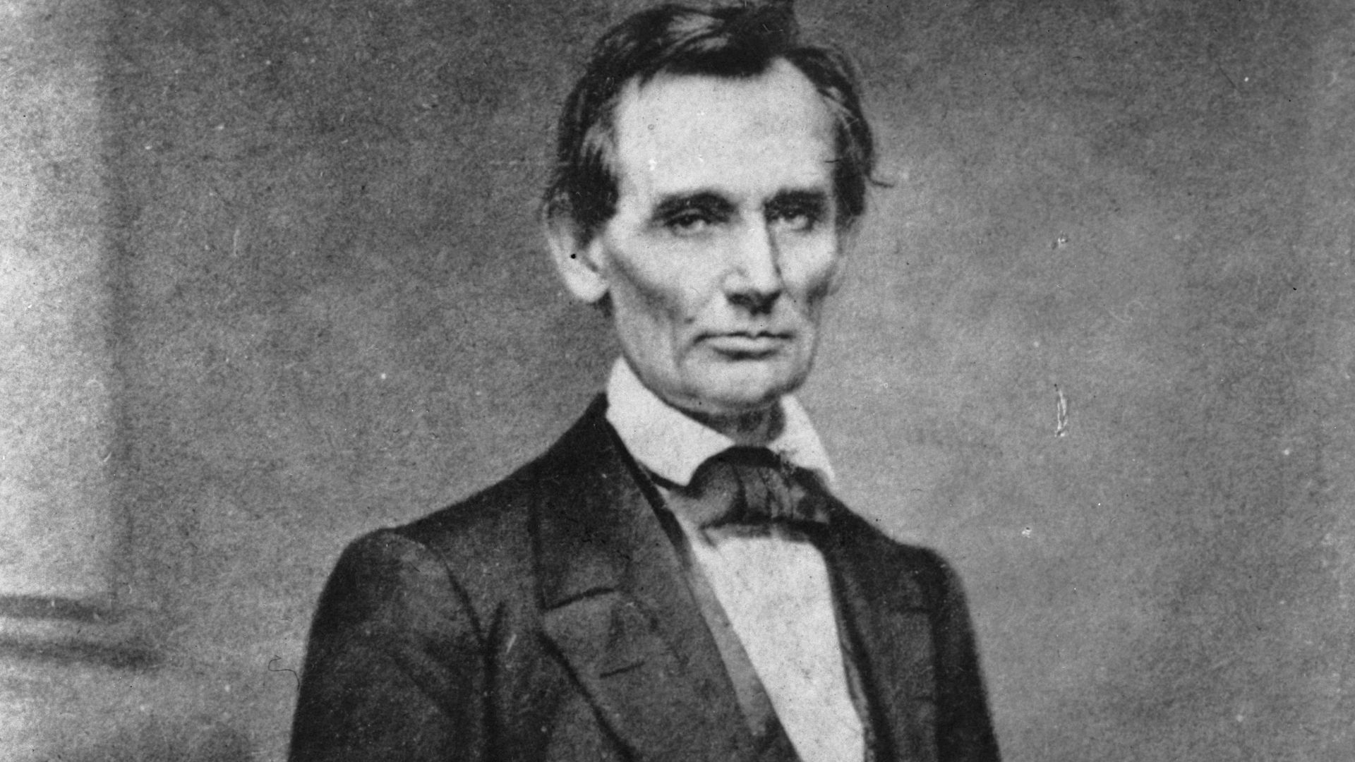 A black and white portrait photograph of Abraham Lincoln in 1860.