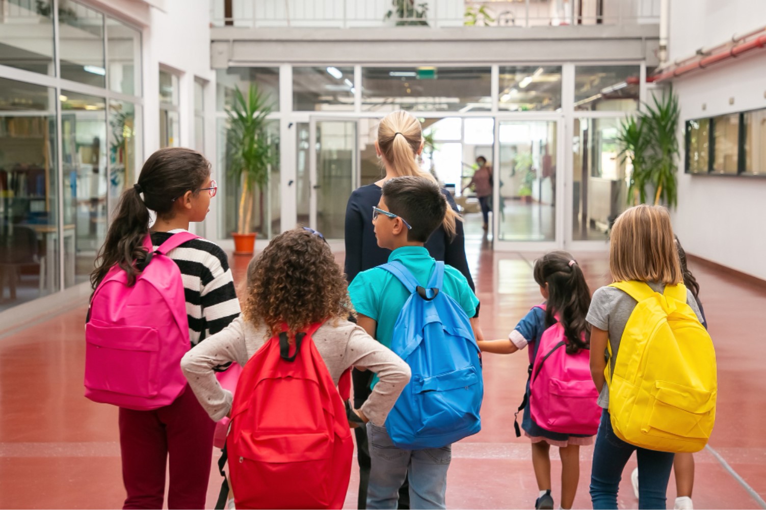 A group of children are pictured walking to school together
